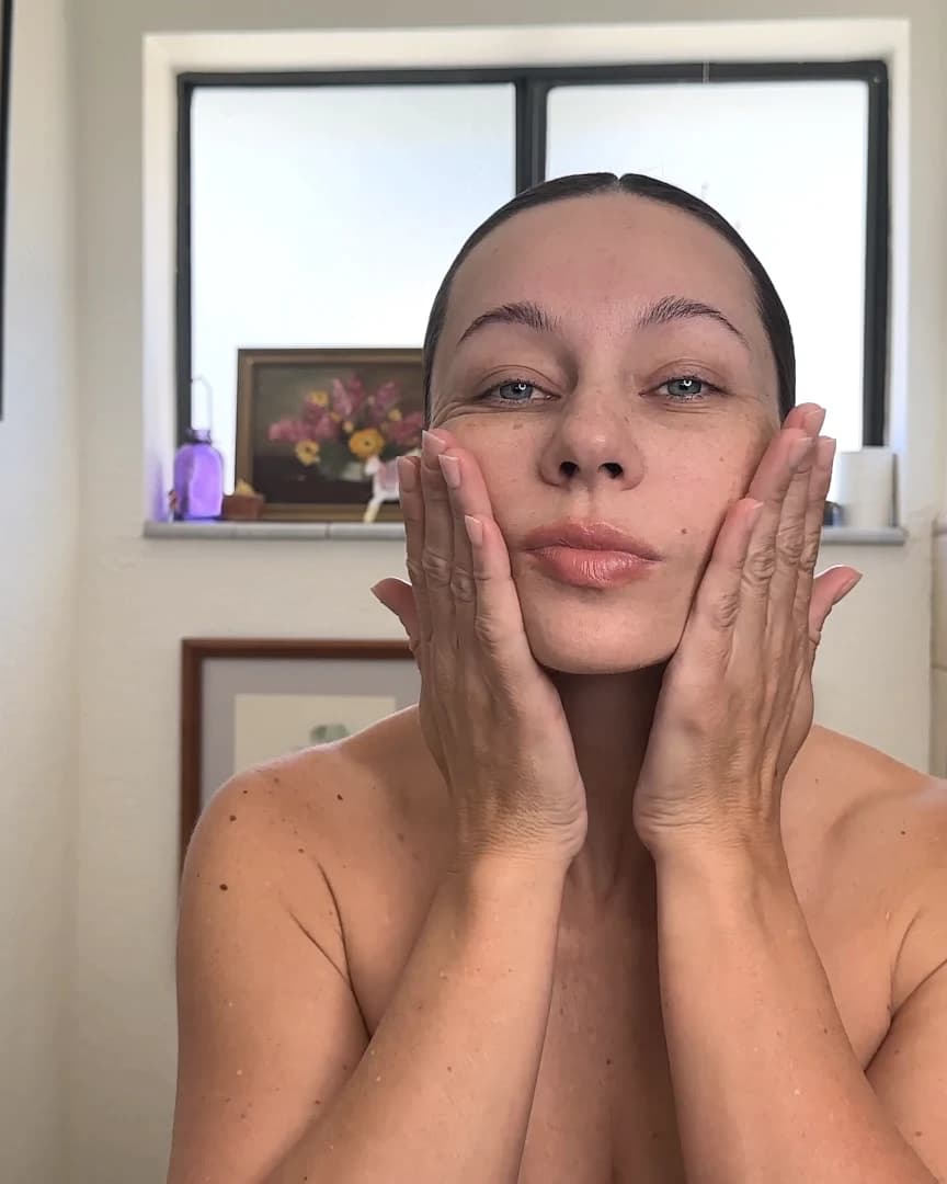 Shannon practicing her LIFT facial massage with both hands